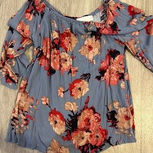 Rose Karlid over the should blouse.